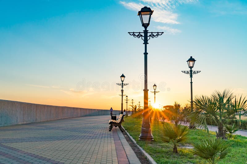 Cityscape with sunset view over the waterfront of the resort town. Sochi, Russia. royalty free stock photography