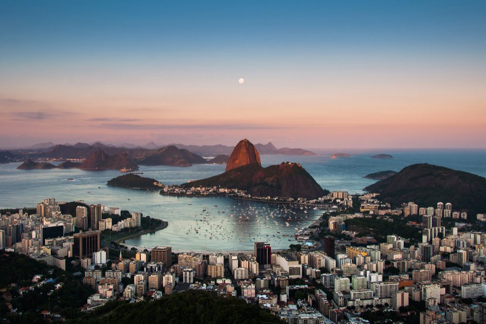 Sugarloaf Mountain and Botafogo Neighborhood in Rio de Janeiro by Sunset with Full Moon in the Sky